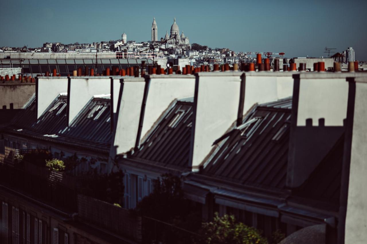 Monsieur George Hotel & Spa - Champs-Elysees Paris Eksteriør bilde View of the roofs of Paris